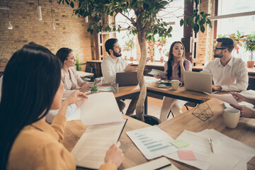 Photo of business people partners colleagues sit around table members successful anti crisis crash...