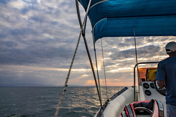 Iconic sunset over boat at lake Malawi