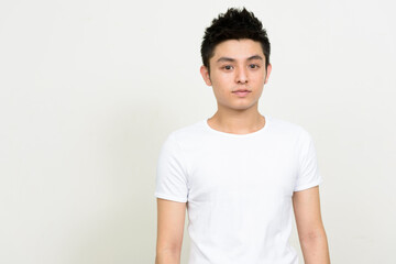 Obraz premium Portrait of young handsome Asian man looking at camera
