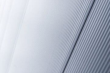 Gray corrugated Metal Sheet Wall Background with shiny reflection gradation