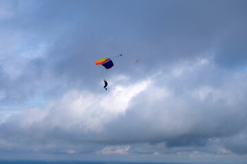 Fototapeta na wymiar Skydiving. A parachute is in the sky.