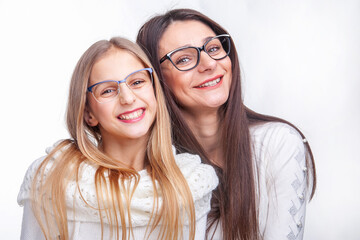 woman and girl teenager in glasses for vision in the studio