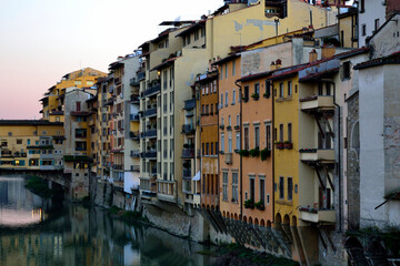 Fototapeta na wymiar Florence, tuscany, Italy. Side view of the Arno riverside inside the city closed to Ponte Vecchio. Detail of the many different old historical housesholidays, italian, italy, landmark, la