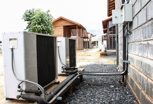 Air conditioning compressor on wall.