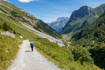 Fototapeta na wymiar Hikking the GR5 at Pralognan-la-Vanoise, Savoie in France. This trail is famous for its route through the French Alps from Lake Geneva to Nice called Grande Traversée des Alpes