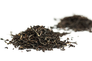 Leaves of black premium dry tea on a white background
