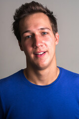 Fototapeta premium Face of happy young handsome man smiling