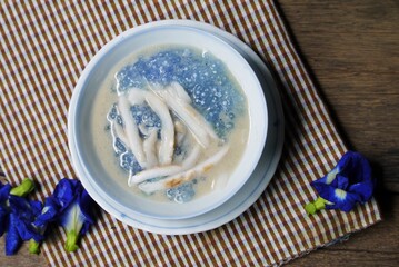 Sago and  young coconut  in coconut milk on  table cloth   prepare for serving  in the  kitchen  , Thai  dessert  image for background , selective focus .