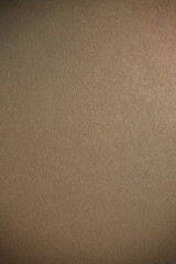 Dark cream background with a beautiful partial dimming pattern