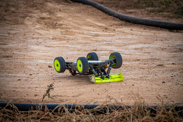 RC buggy upside down after tumbling at the outdoor track © Peter