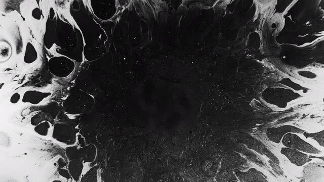 Ink grunge background. Surreal universe. Black glitter liquid splash with spreading copy space on white.