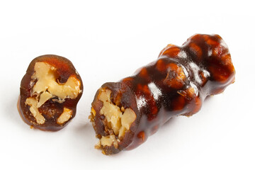 Walnuts on a string dipped in starch grape molasses. Churchkhela. Walnut sujuk.