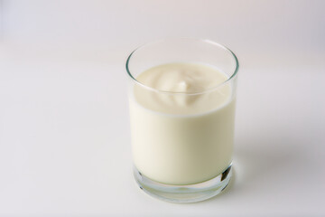 glass of yogurt on a white background