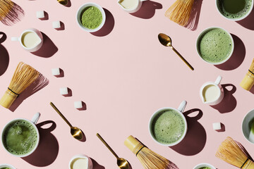 Flat lay of tools for making and cups of vegan matcha latte with oat milk