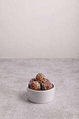 Raw food balls in a bowl with carob