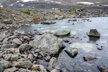 View of the area near The Lake Blavatnet, rocks and water, Lyngen Alps, Norway