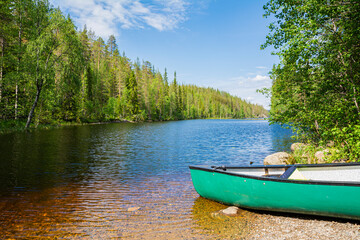 View of the canyon lake Julma-Olkky and canoe on the shore, Hossa National Park, Kuusamo, Finland