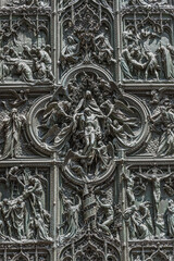Heavy big metal doors to Duomo di Milano, Cathedral of Milano, Italy