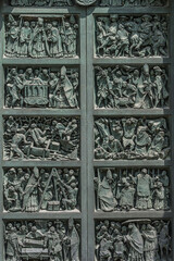 Heavy big metal doors to Duomo di Milano, Cathedral of Milano, Italy