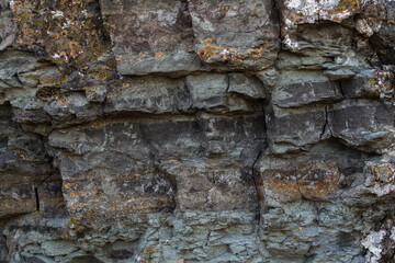 Stoun rock is fractured, with cracks forming interesting fragments and interesting texture