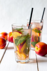 Cold peach tea with mint. Cold drinks. Healthy eating. Vegetarian food.