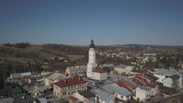 Biecz, Poland - 3 9 2019: Panorama of the historic center of the European medieval city on the picturesque green hills. Trips to architectural monuments: temples, central square, town hall, municipal