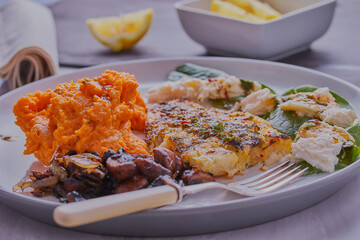 Cod fillet with mushrooms and creamed sweet potato.