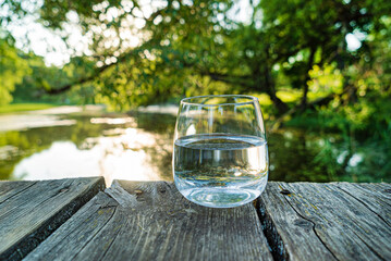 glass of clean water outdoor - obrazy, fototapety, plakaty