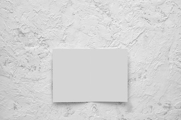 Mockup opened booklet, postcard, flyer, or brochure on cement background.