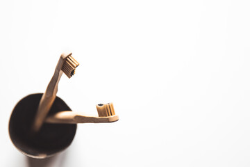 Wooden bamboo toothbrushes on white background isolated. The concept of zero waste, recycling
