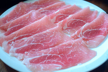 Shabu Raw thin sliced pork in plate for boiling. Japanese style hotpot buffet.