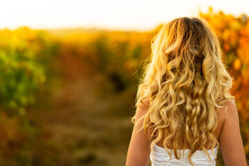 Vintage portrait woman in the vineyard. Autumn backgrounds