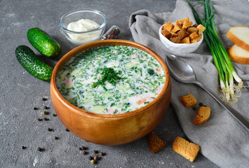 Traditional Russian summer cold soup, okroshka. Bulgarian cold soup, Tarator served on the table.