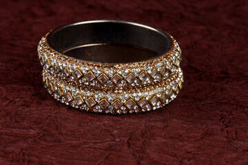 Indian Bangles. Bracelet with diamonds on a textured background, Indian Traditional Jewellery,Style, fashion and design of jewelry