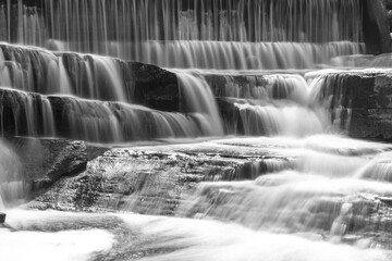 Buttermilk Falls and Mill in Forest Mills Ontario with long exposure waterfalls and original Mill in the forest.