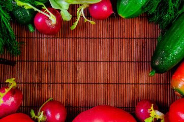 vegetables vegan fresh dill cucumbers cabbage radish sweet red pepper tomato carrots on the sides assorted closeup top view with space for insertion