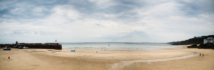 Fototapeta na wymiar Panorama of St. Ives beach at low tide in Cornwall in England
