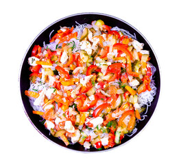 fungoza salad cellophane rice and delicious tasty vegetables red bell pepper carrots cucumber dill greens tomato onion shredded fried chicken meat in a pan with a handle together on a white background
