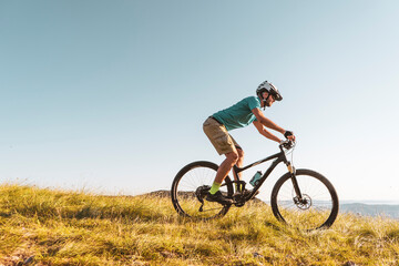 Fototapeta premium Man riding his mountain bike outdoor in nature