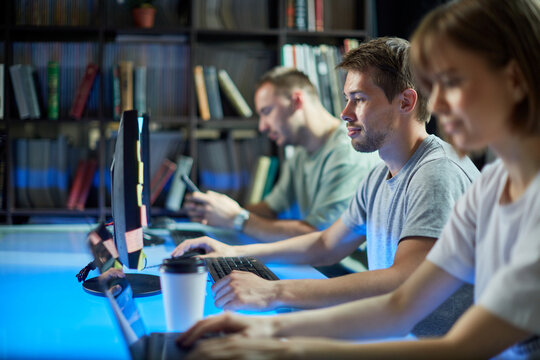 Team of professional programmers engineers develop code for the game working on new project, photo for ad IT technology - Powered by Adobe