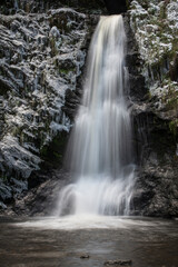 Fototapeta na wymiar Woodland Snow waterfall Landscape