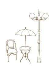Chair and umbrella under a lamppost