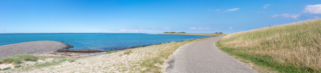 Fototapeta na wymiar Beach and bikeway in Kamperland Noord-Beveland in the state of Zeeland Netherlands