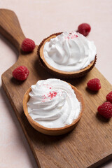 Close up cup cakes with cream and berries