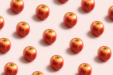 Apple minimal pattern at soft pink background. Concept of harvest raw food