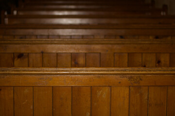 Old wooden church pews as background with space for copy