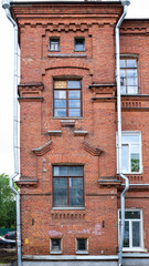 Fototapeta premium Architectural detail tower outbuilding old red brick residential house.