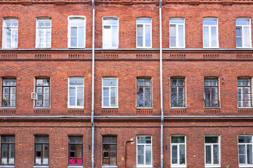 Fototapeta na wymiar facade of an old red brick building