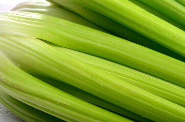 fresh Celery stalk isolated on white wooden background
