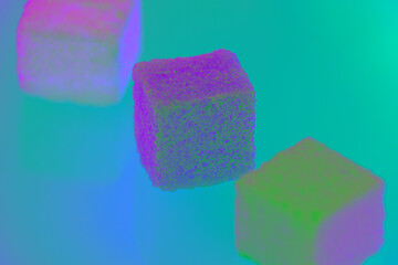 Strange colorful sugar cubes on the background